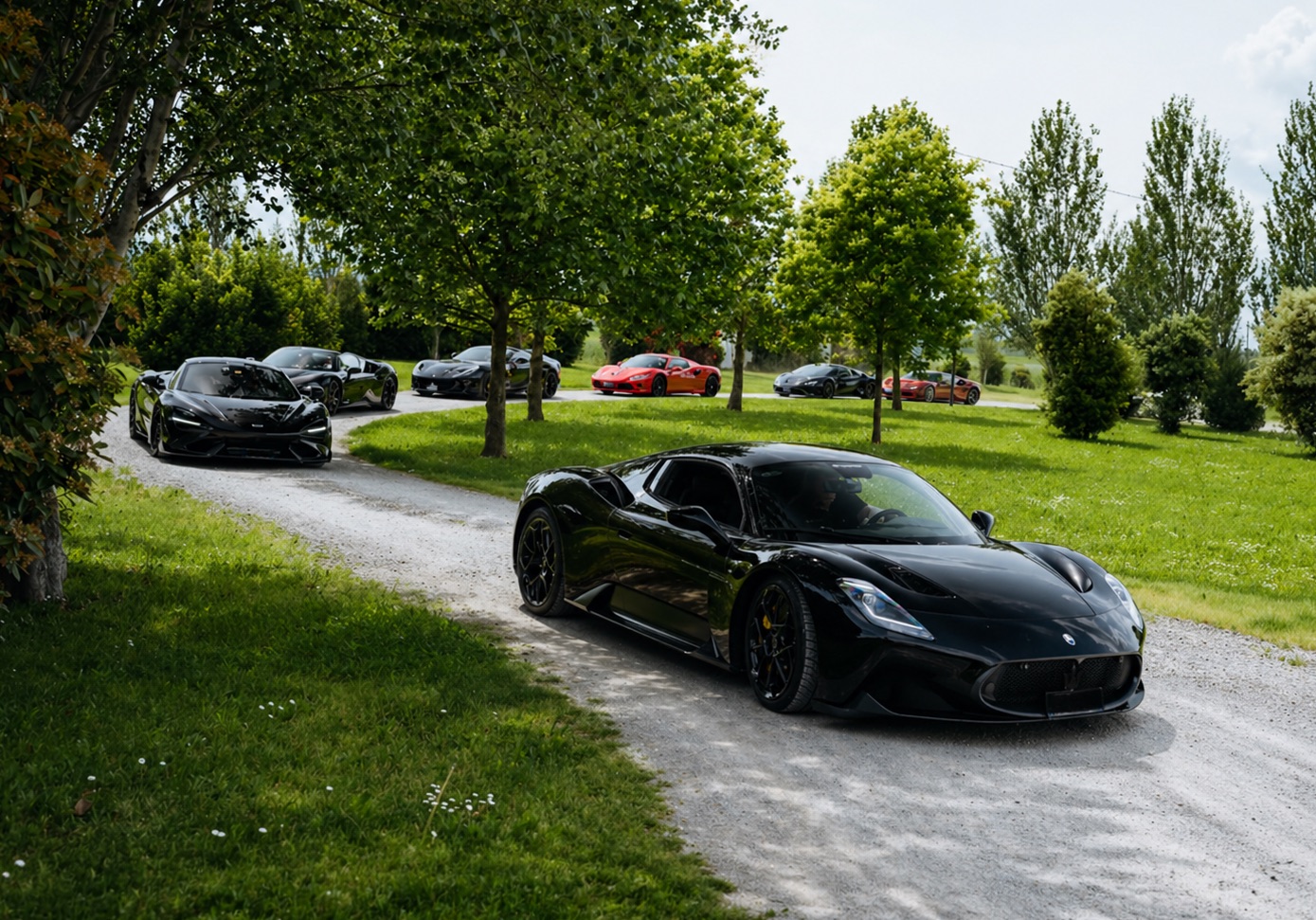 Supercars driving through the Tuscan estate